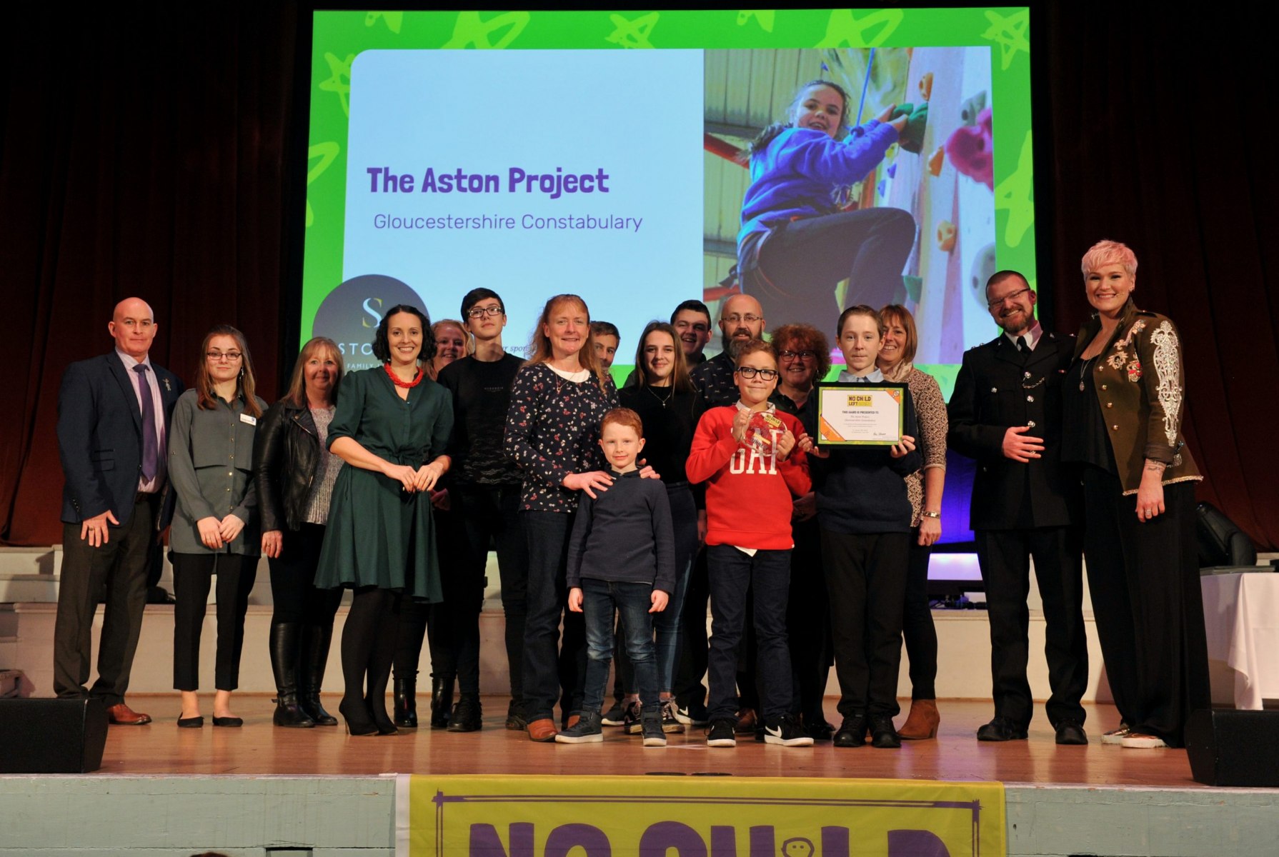 No Child Left Behind awards ceremony at Cheltenham Town Hall. Positive Relationships Award presented by Louise Chipchase (Stowe Family Law) to The Aston Project